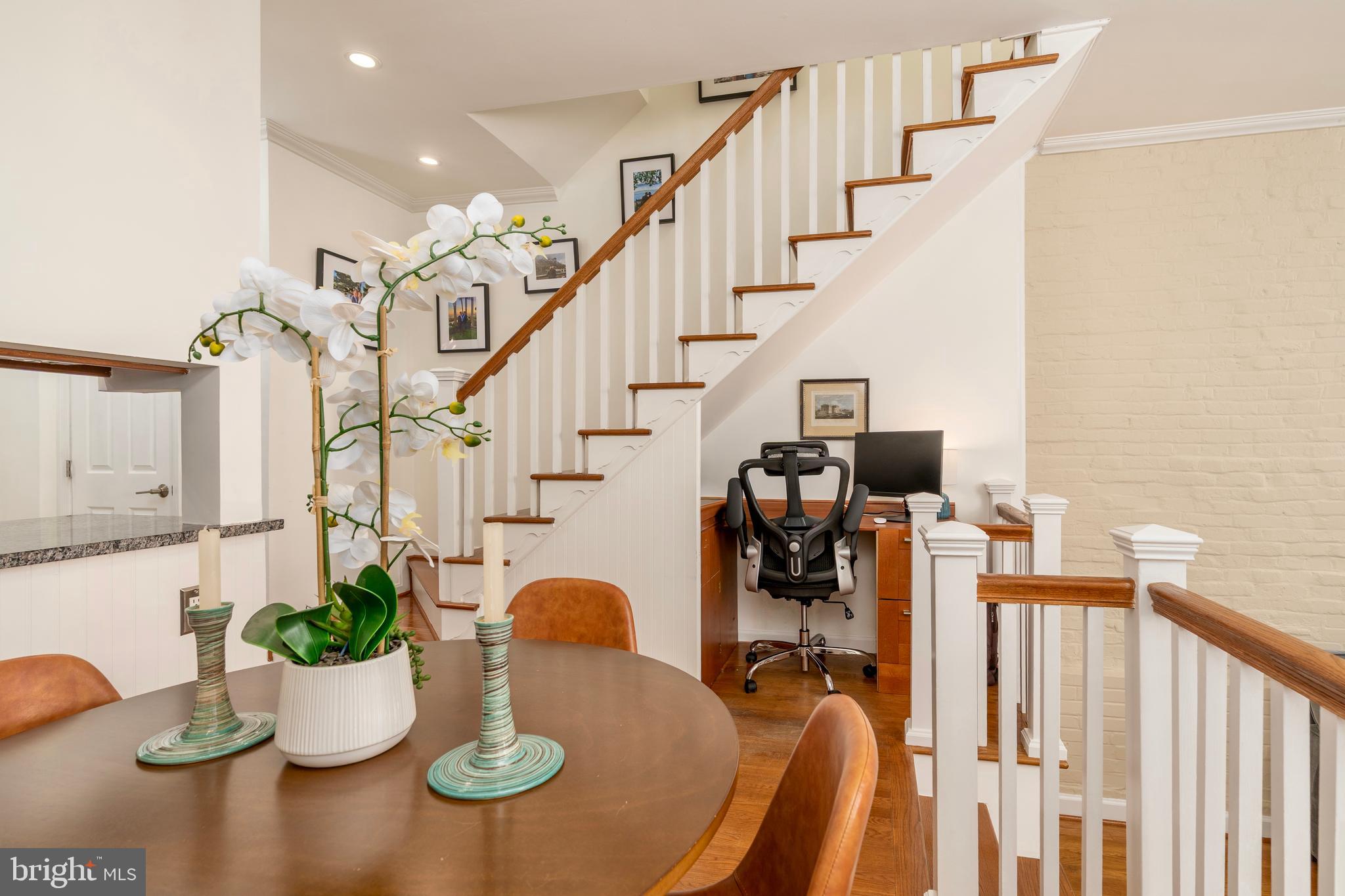 1433 S Street Northwest, Unit 2 Washington, DC 20009 - Photo 11 of 44 a dining room with furniture potted plants and wooden floor