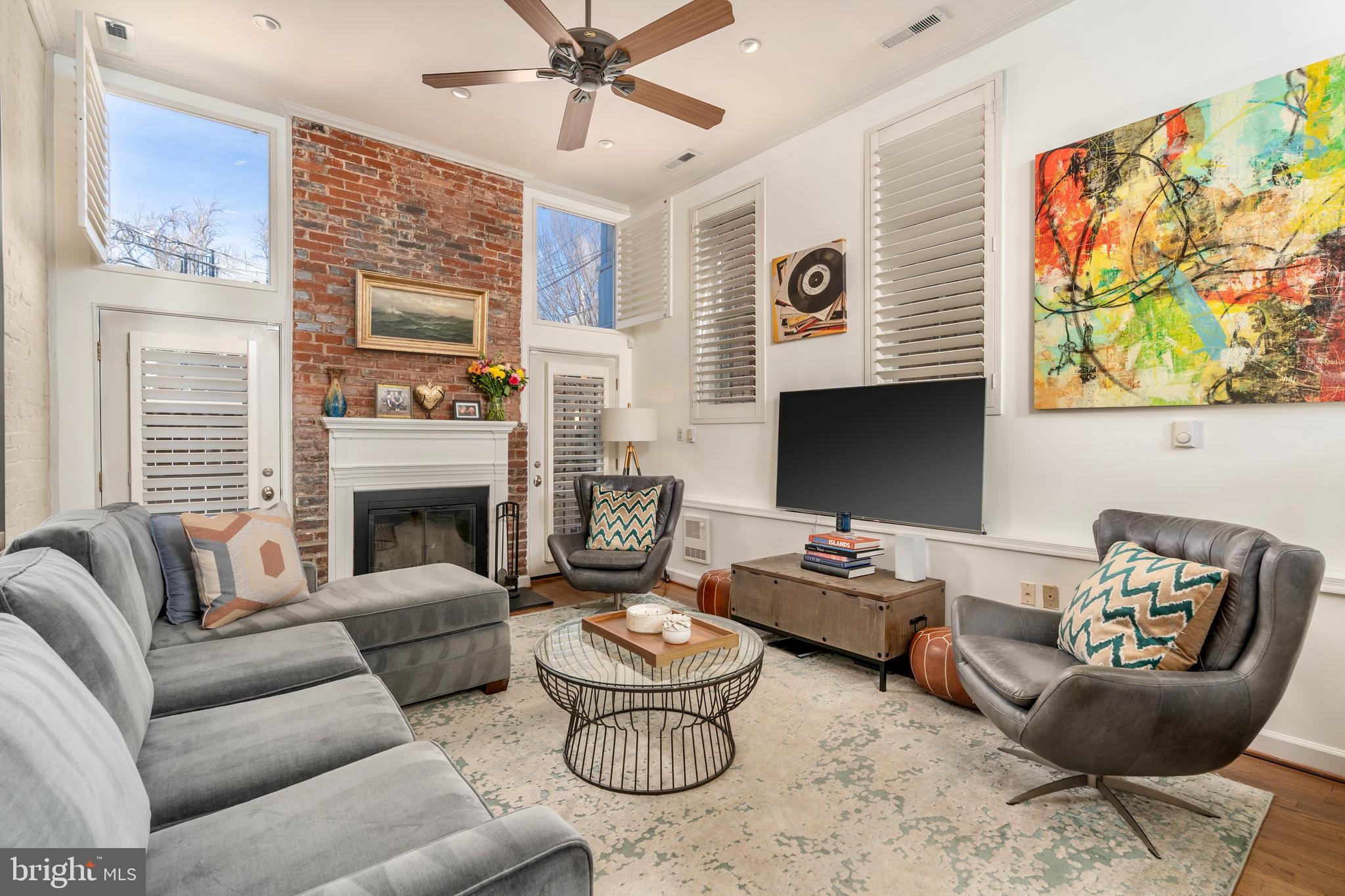 1433 S Street Northwest, Unit 2 Washington, DC 20009 - Photo 14 of 44 a living room with furniture and a fireplace