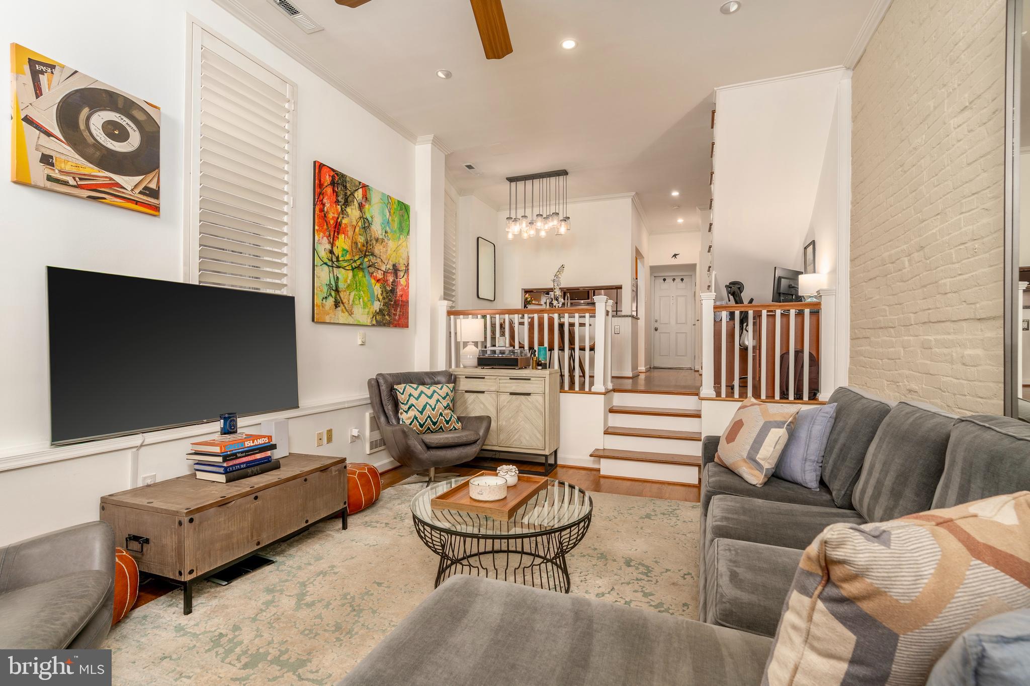 1433 S Street Northwest, Unit 2 Washington, DC 20009 - Photo 15 of 44 a living room with furniture and a flat screen tv