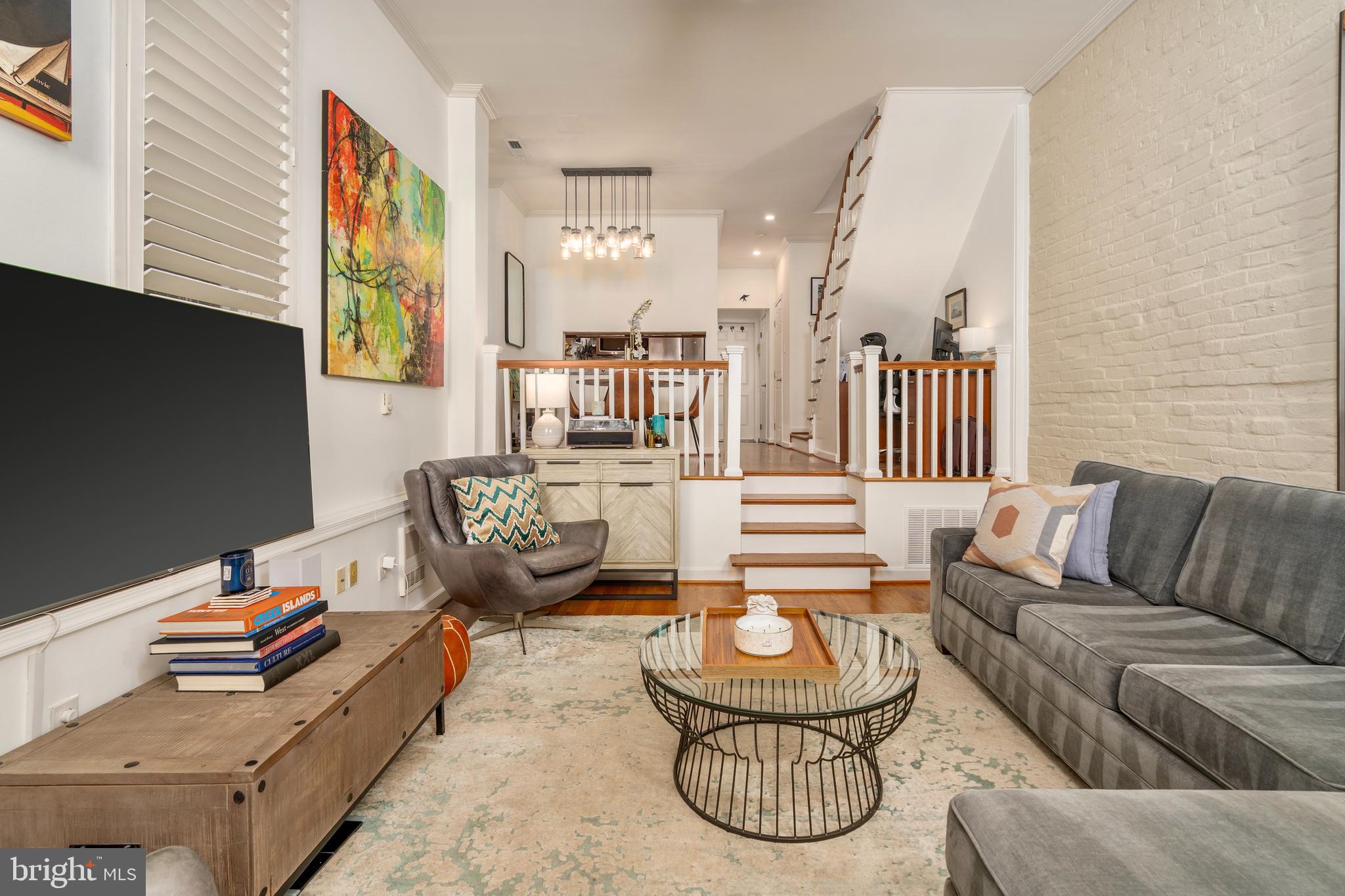 1433 S Street Northwest, Unit 2 Washington, DC 20009 - Photo 16 of 44 a living room with furniture and a flat screen tv
