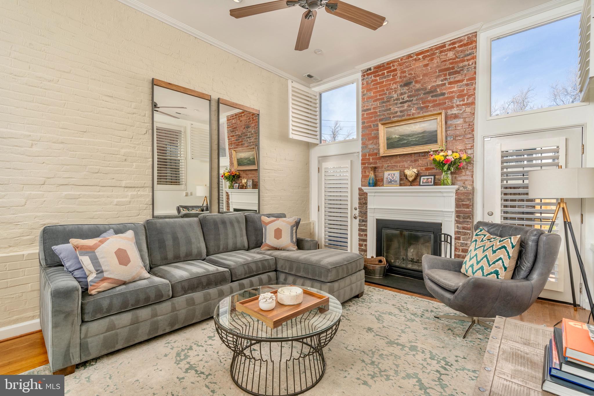 1433 S Street Northwest, Unit 2 Washington, DC 20009 - Photo 17 of 44 a living room with furniture and a fireplace