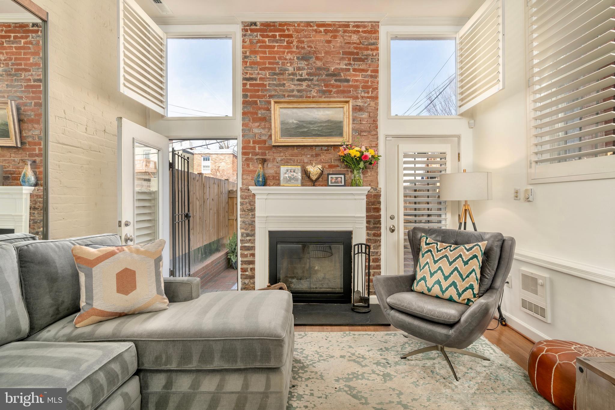 1433 S Street Northwest, Unit 2 Washington, DC 20009 - Photo 19 of 44 a living room with furniture and a fireplace