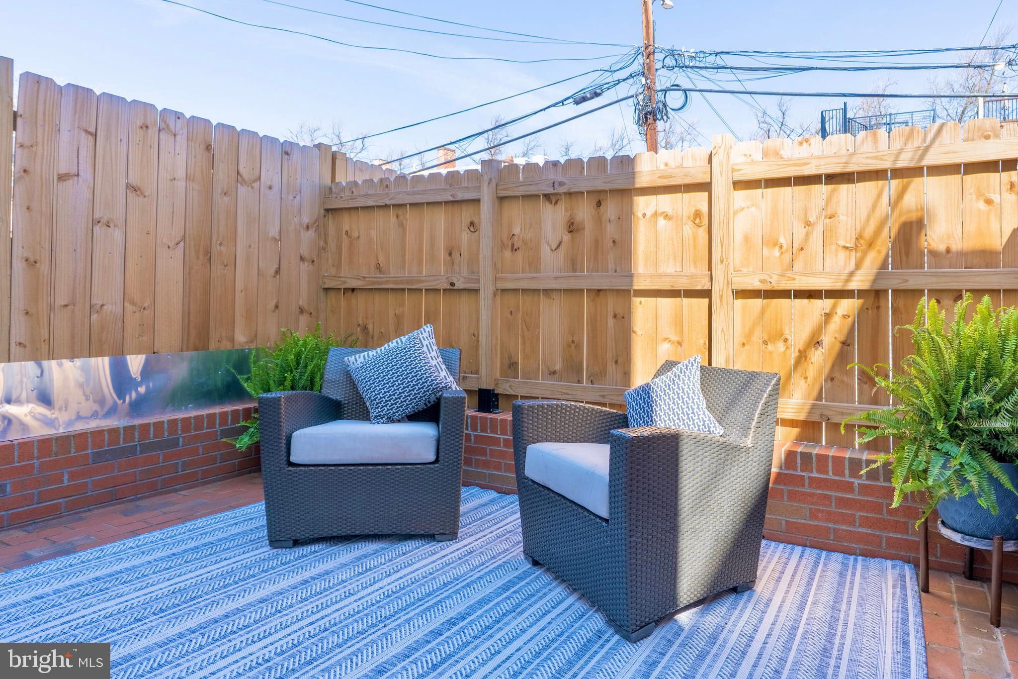 1433 S Street Northwest, Unit 2 Washington, DC 20009 - Photo 23 of 44 a living room with furniture and wooden floor
