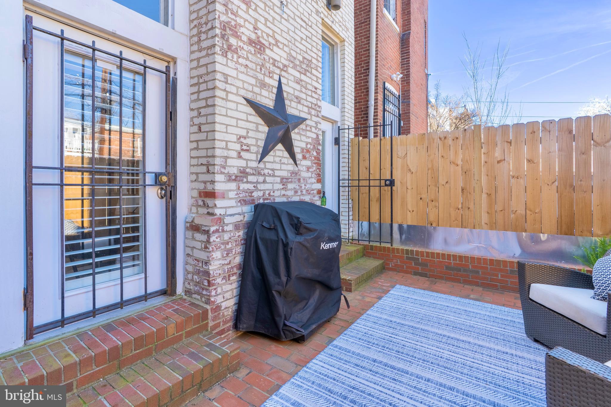1433 S Street Northwest, Unit 2 Washington, DC 20009 - Photo 25 of 44 a living room with furniture and a window