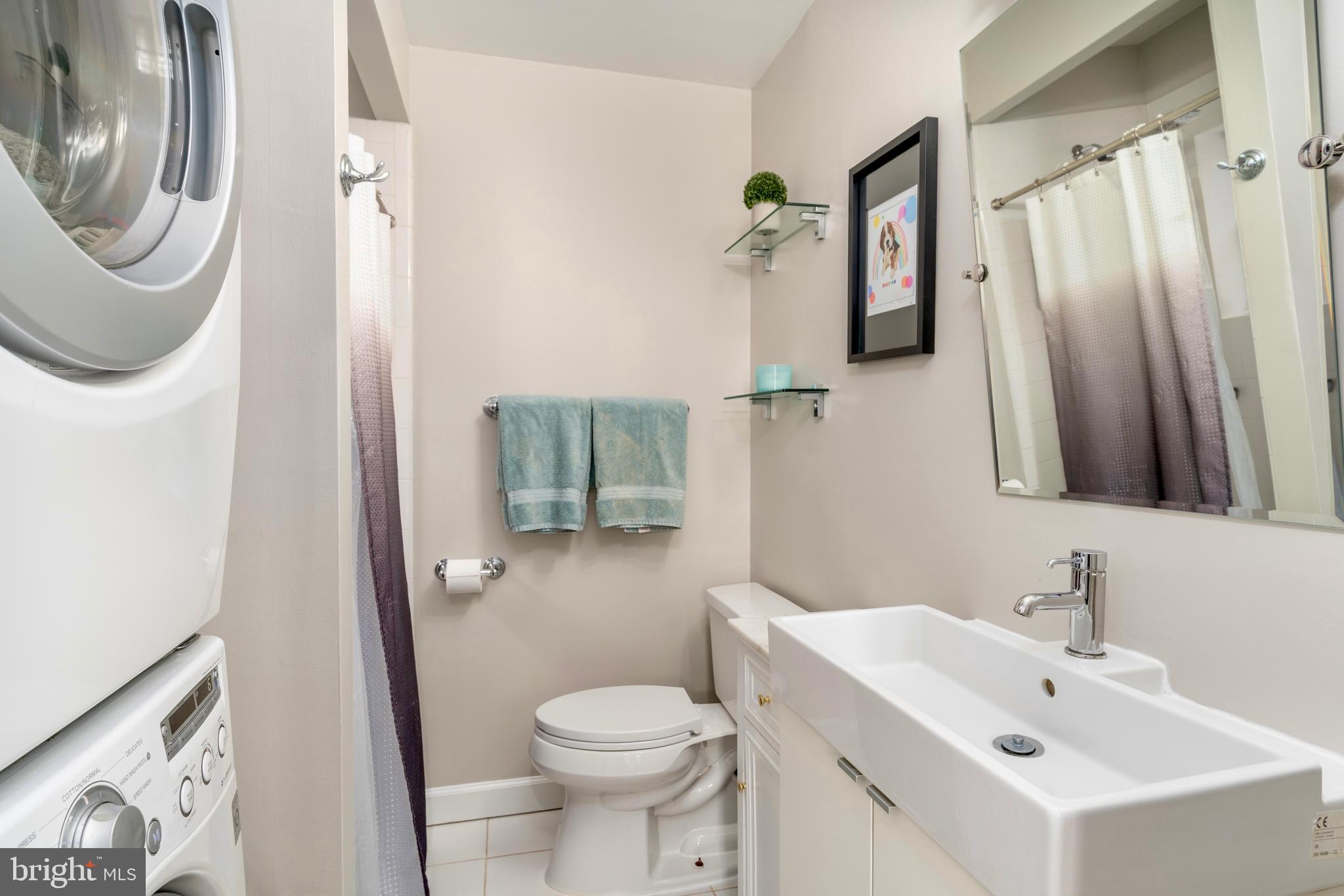 1433 S Street Northwest, Unit 2 Washington, DC 20009 - Photo 29 of 44 a bathroom with a sink a toilet and shower