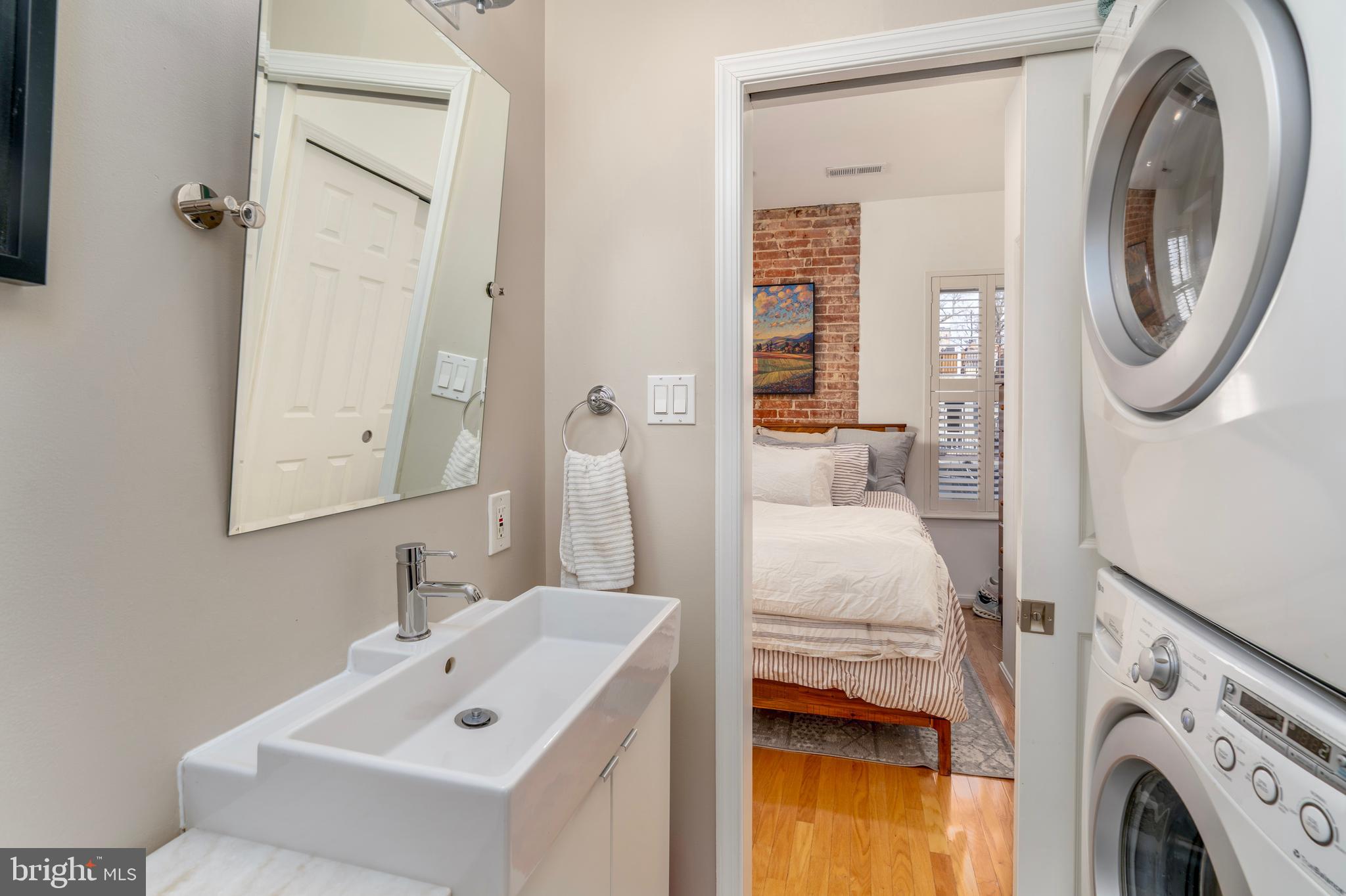 1433 S Street Northwest, Unit 2 Washington, DC 20009 - Photo 31 of 44 a en suite bathroom with a sink and a mirror