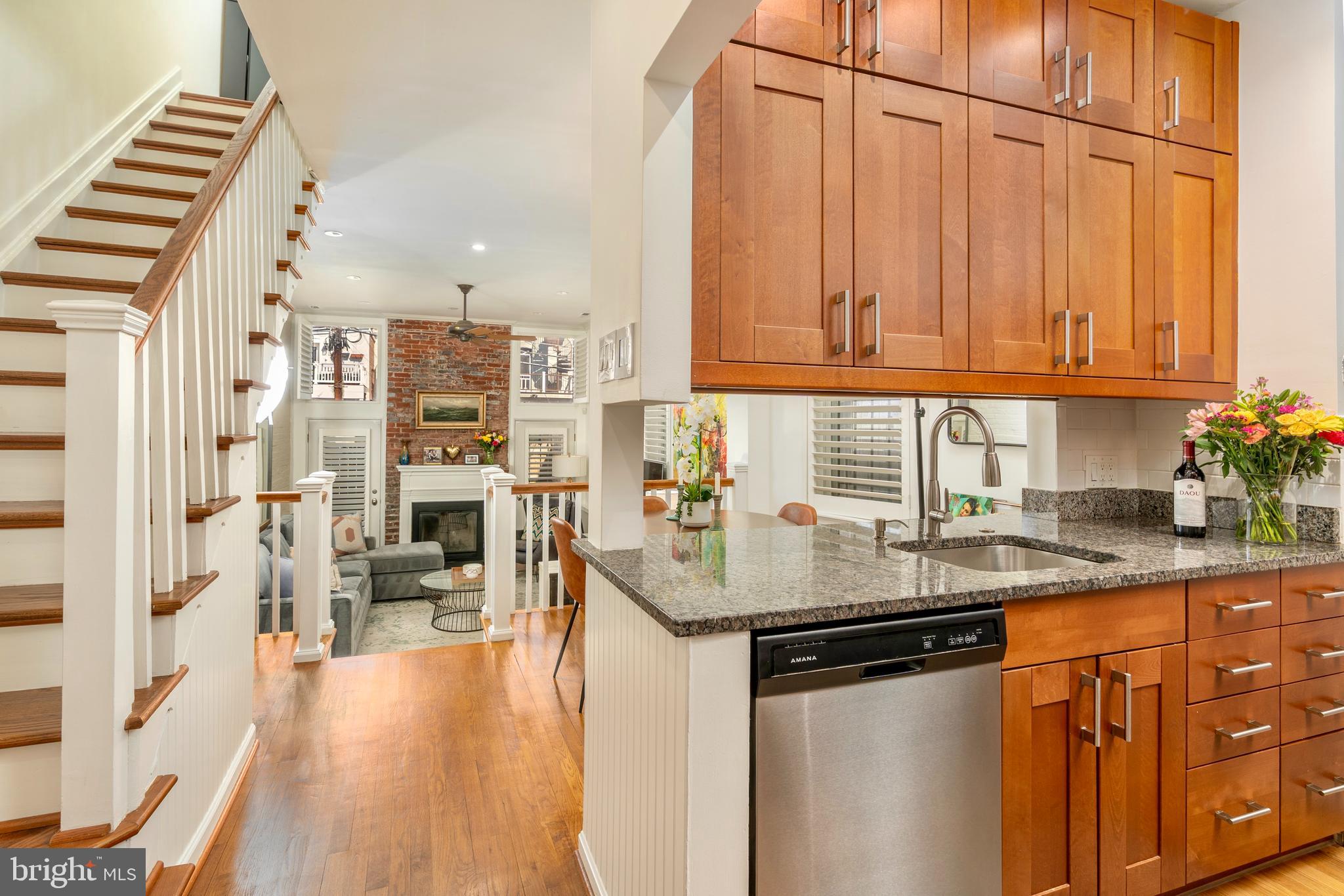 1433 S Street Northwest, Unit 2 Washington, DC 20009 - Photo 4 of 44 a kitchen with stainless steel appliances granite countertop a sink and cabinets
