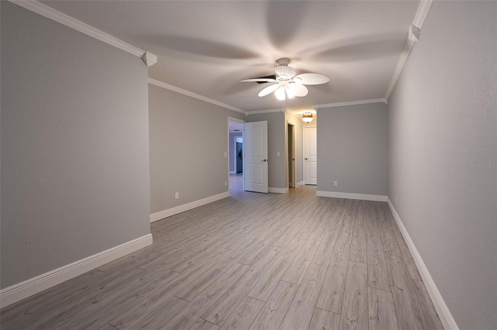 350 Boca Ciega Point Boulevard St. Petersburg, FL 33708 - Photo 13 of 25 wooden floor in an empty room with a window