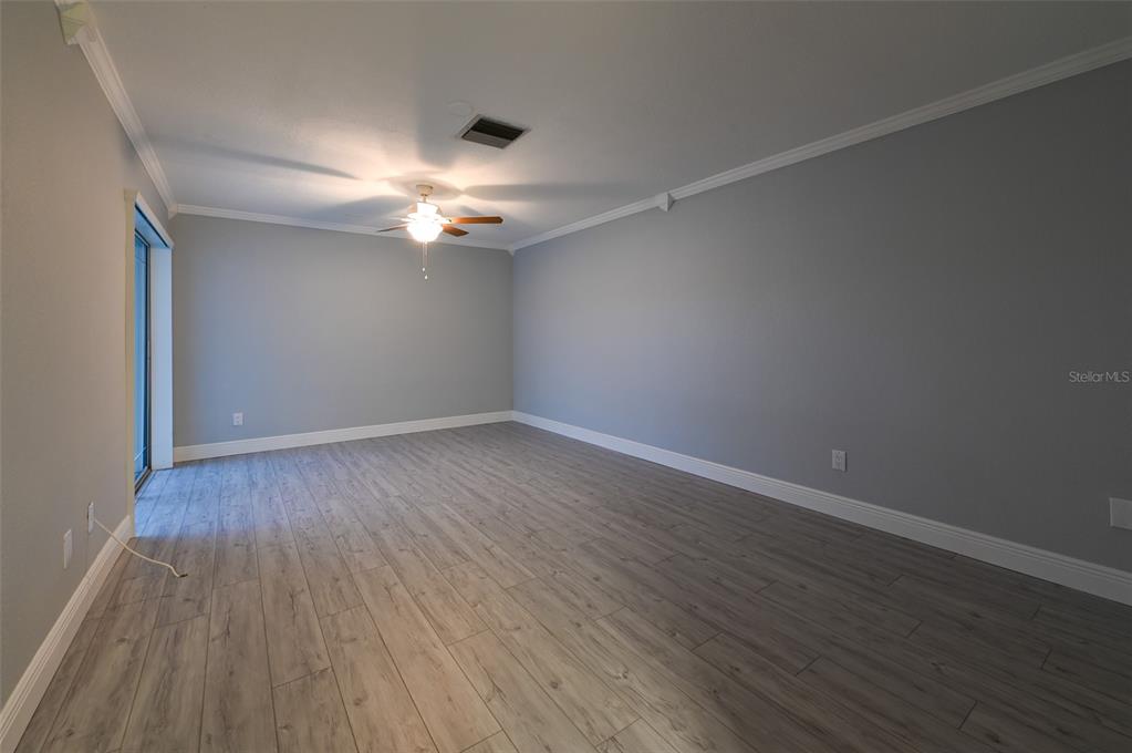350 Boca Ciega Point Boulevard St. Petersburg, FL 33708 - Photo 16 of 25 a view of an empty room with wooden floor