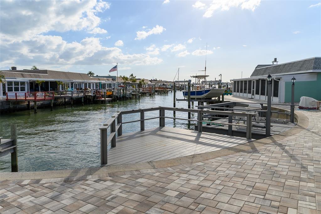 350 Boca Ciega Point Boulevard St. Petersburg, FL 33708 - Photo 19 of 32 a view of a lake with chairs