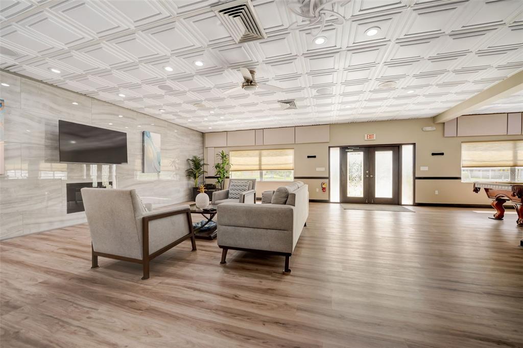 350 Boca Ciega Point Boulevard St. Petersburg, FL 33708 - Photo 25 of 32 a living room with furniture and a flat screen tv