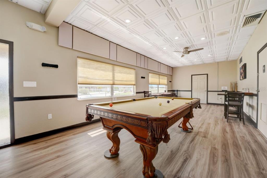 350 Boca Ciega Point Boulevard St. Petersburg, FL 33708 - Photo 26 of 32 a room with pool table and windows