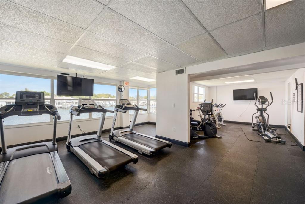 350 Boca Ciega Point Boulevard St. Petersburg, FL 33708 - Photo 28 of 32 a room with gym equipment and white walls