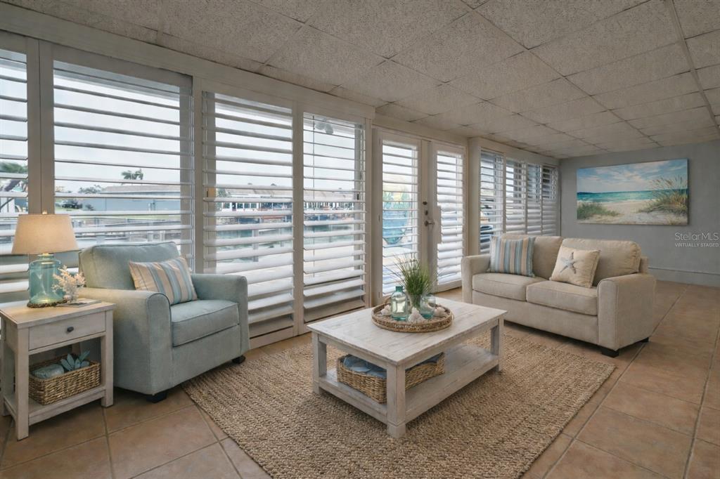 350 Boca Ciega Point Boulevard St. Petersburg, FL 33708 - Photo 3 of 25 a living room with furniture and a large window