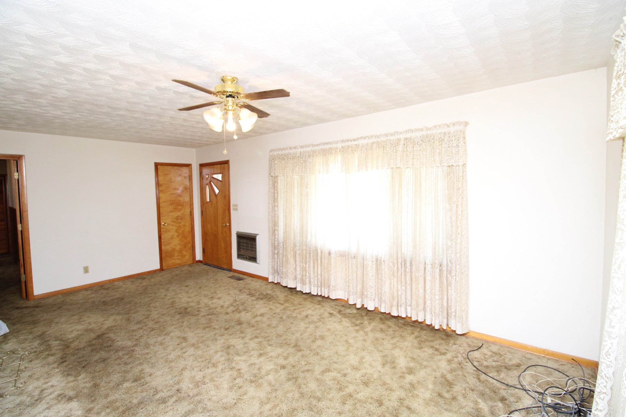1984 Celina Road Red Boiling Springs, TN 37150 - Photo 12 of 28 a view of a room with a ceiling fan and a window