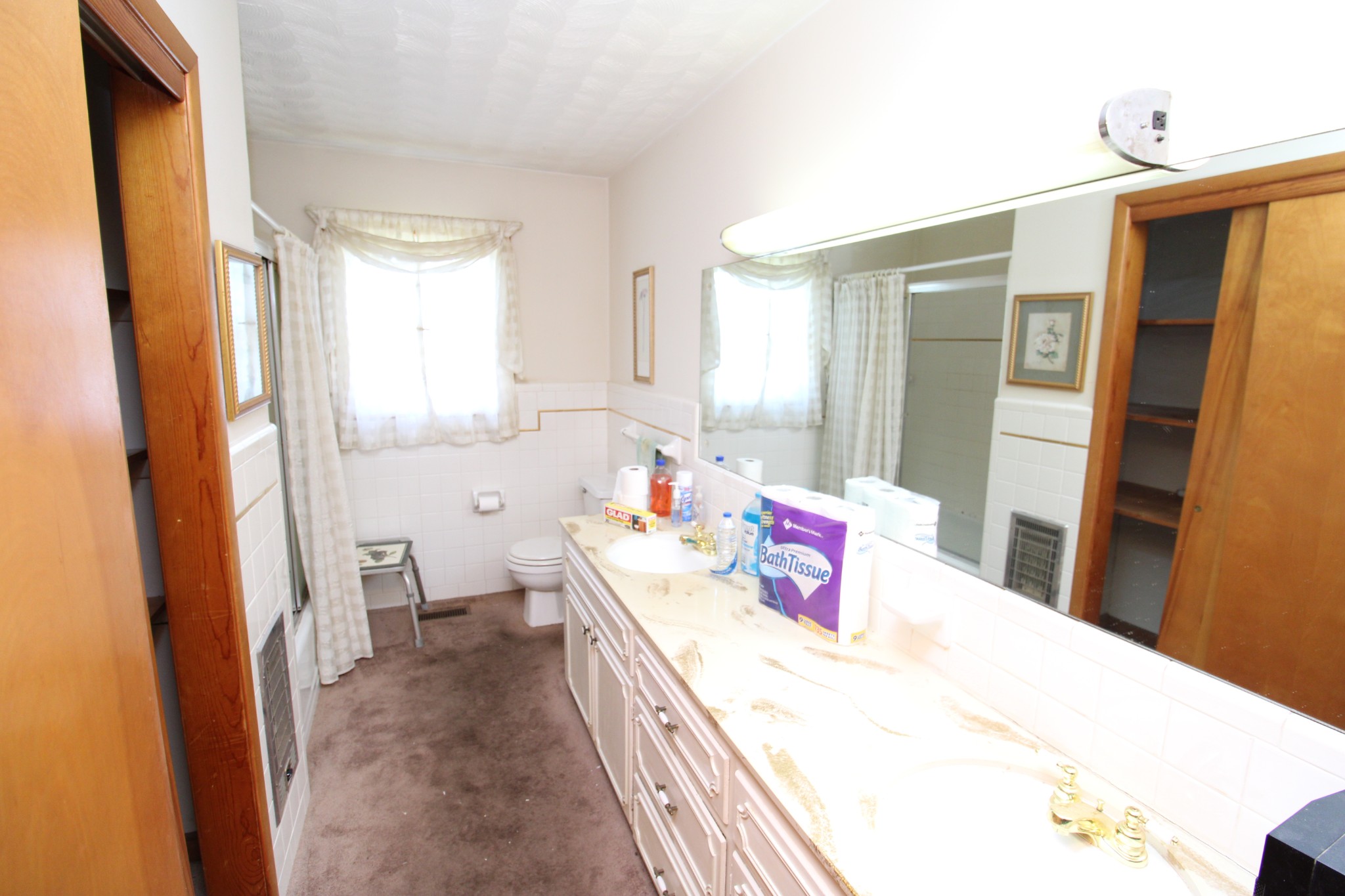 1984 Celina Road Red Boiling Springs, TN 37150 - Photo 22 of 28 a en suite bathroom with a sink a large mirror and a shower