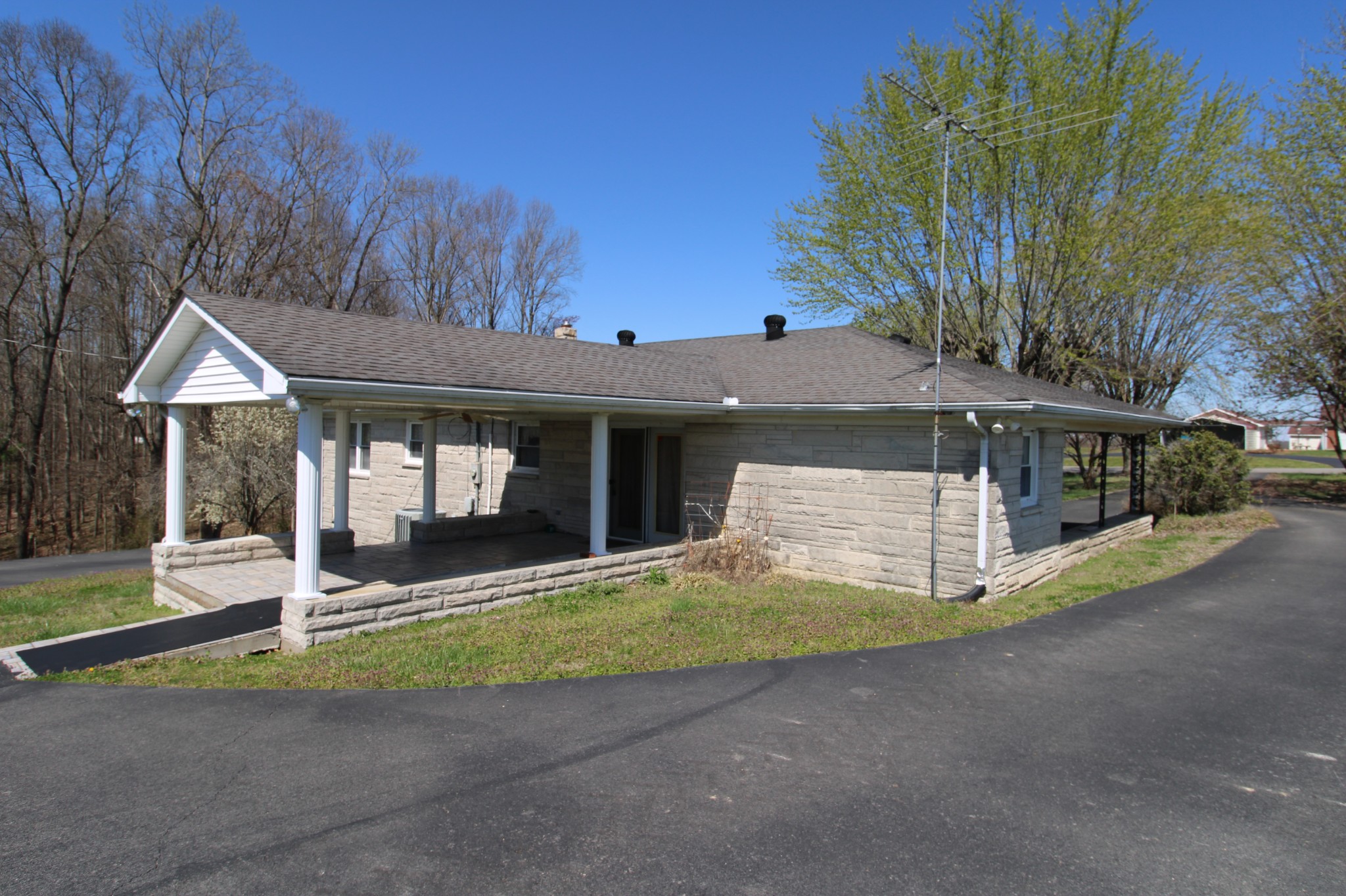 1984 Celina Road Red Boiling Springs, TN 37150 - Photo 5 of 28 a front view of a house with a yard table and chairs