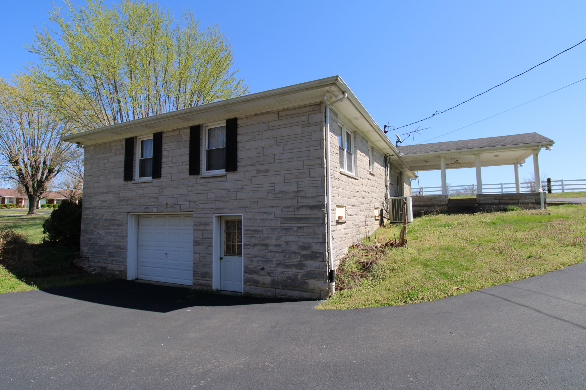 1984 Celina Road Red Boiling Springs, TN 37150 - Photo 7 of 28 a front view of a house with a yard and garage