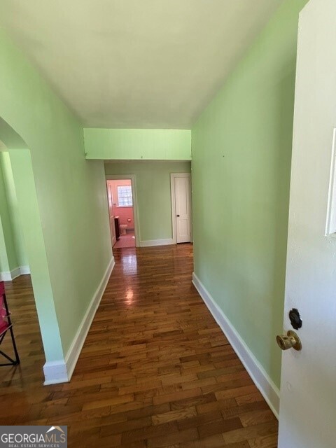 2619 Maple Road Southeast Rome, GA 30161 - Photo 10 of 31 a view of a hallway with wooden floor and staircase