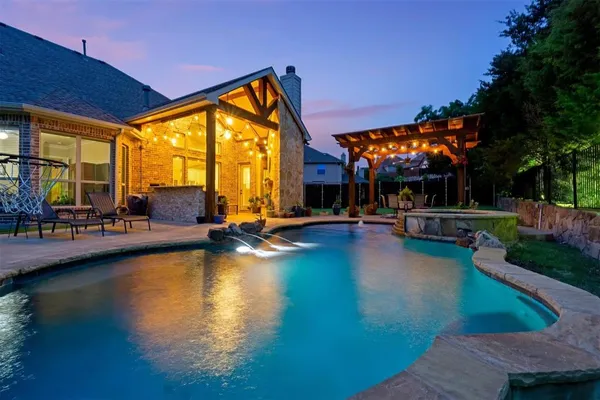 a view of swimming pool with outdoor seating