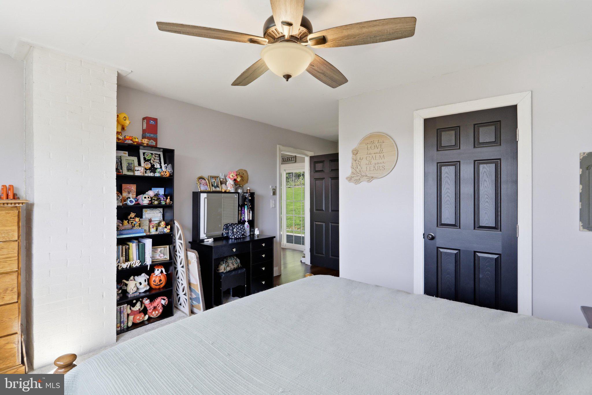 120 Motorcycle Lane Ridgeley, WV 26753 - Photo 29 of 34 a bedroom with a bed and a chandelier