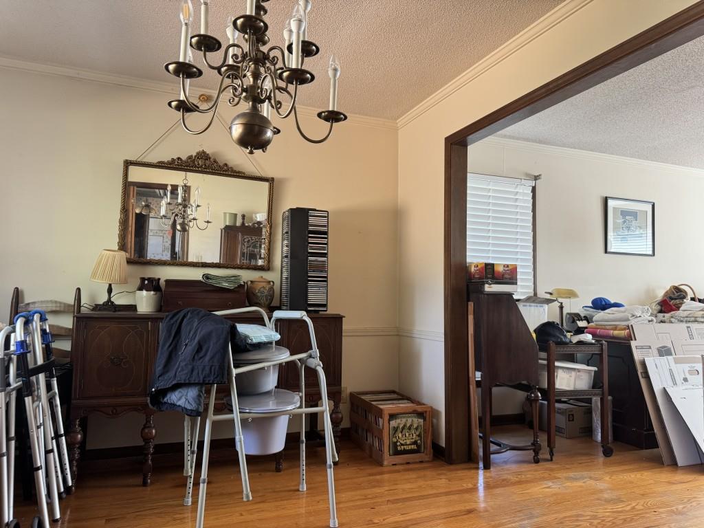 4703 Marc Court Southwest Lilburn, GA 30047 - Photo 15 of 57 a view of a dining room with furniture and wooden floor