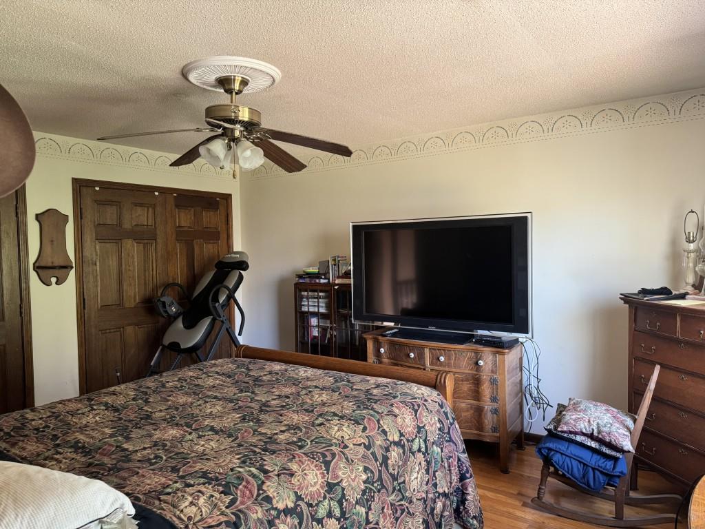 4703 Marc Court Southwest Lilburn, GA 30047 - Photo 32 of 57 a bedroom with a bed and a flat screen tv