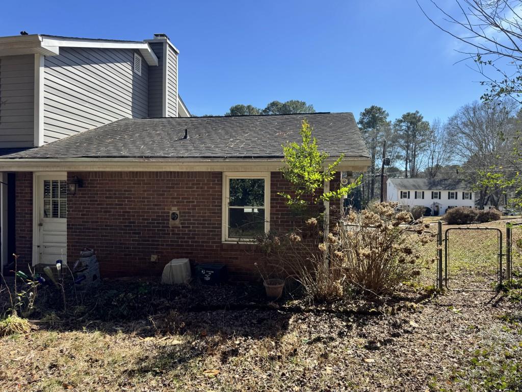 4703 Marc Court Southwest Lilburn, GA 30047 - Photo 52 of 57 a view of a house with a patio