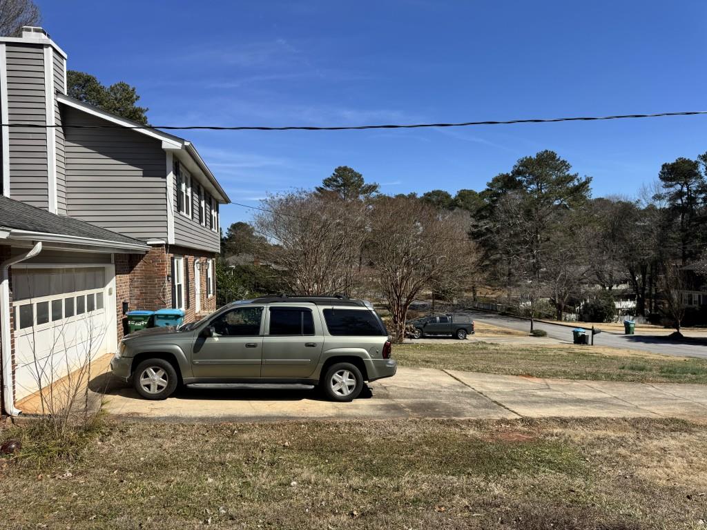 4703 Marc Court Southwest Lilburn, GA 30047 - Photo 55 of 57 a view of a car parked in front of a house