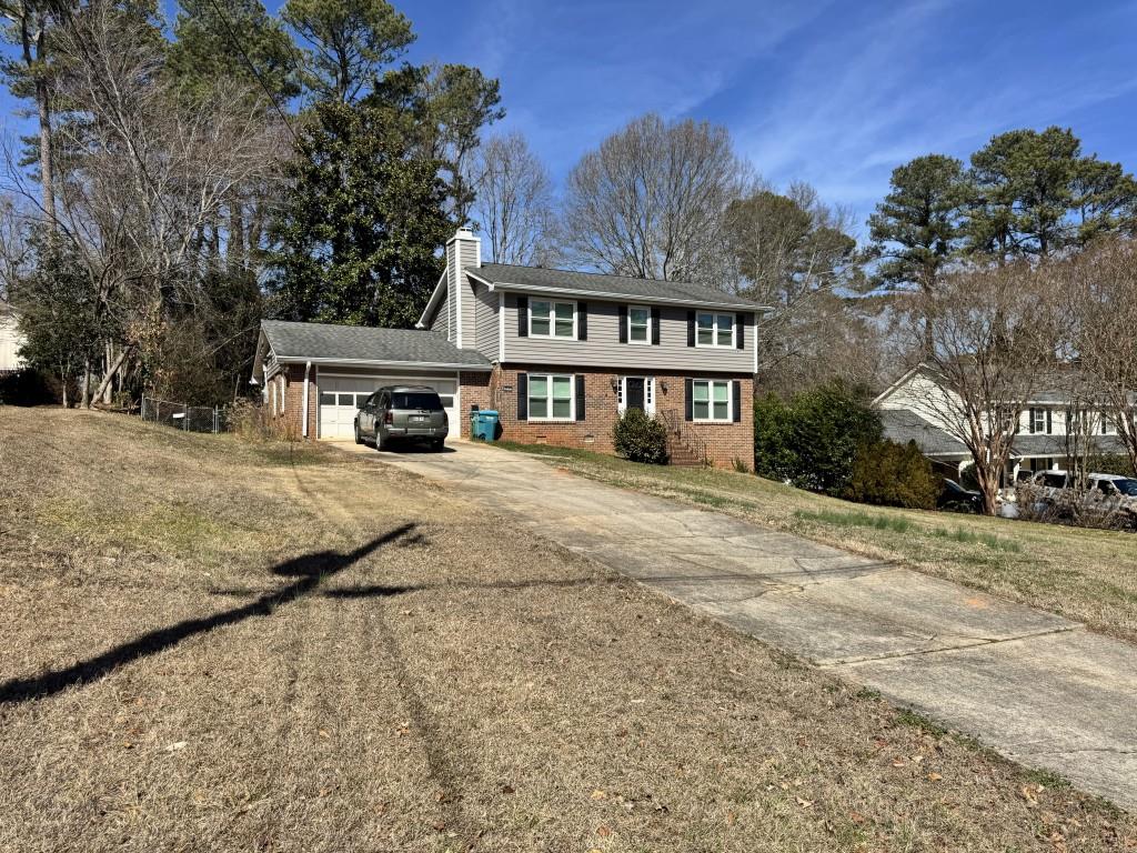 4703 Marc Court Southwest Lilburn, GA 30047 - Photo 56 of 57 a view of a house with a snow on the road
