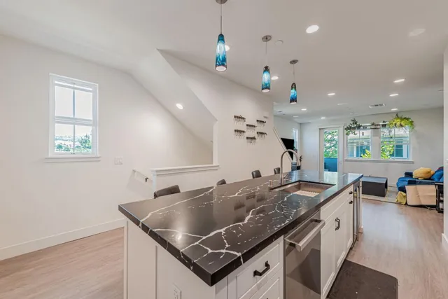 a kitchen that has a lot of cabinets in it