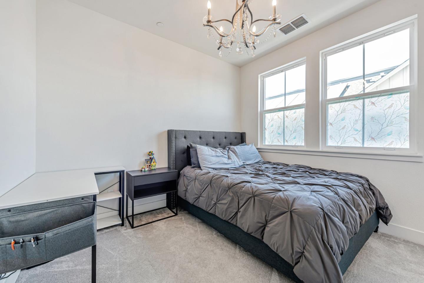 32 Seda Lane Morgan Hill, CA 95037 - Photo 21 of 37 a bed sitting in a bedroom next to a window