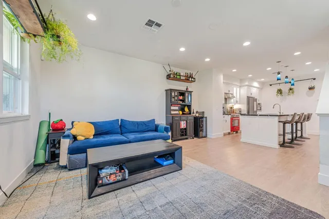 a living room with furniture and a table