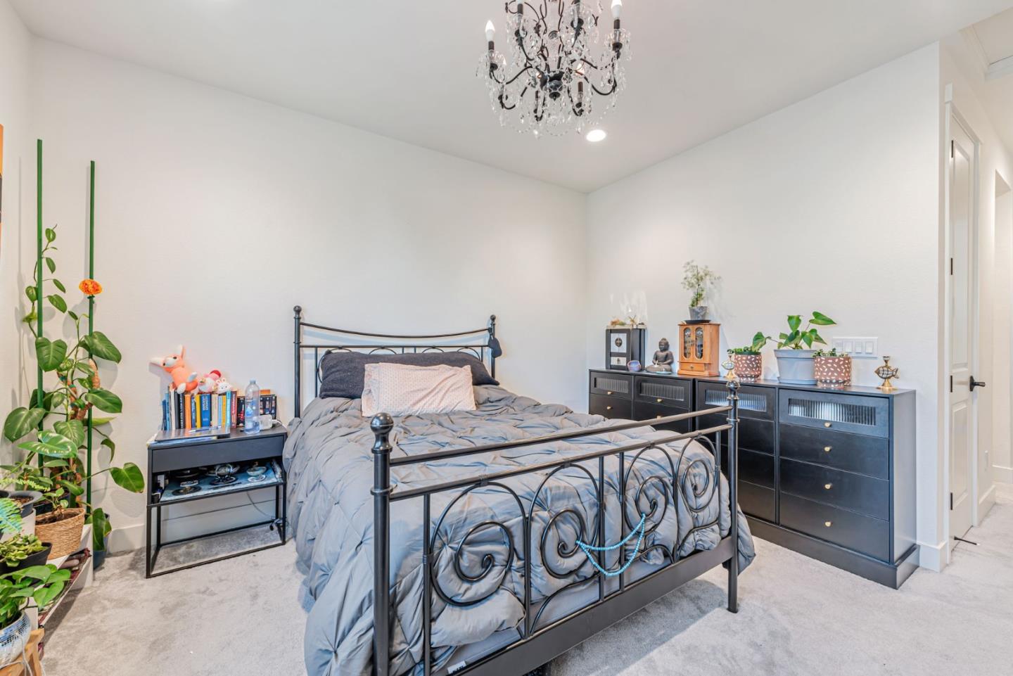 32 Seda Lane Morgan Hill, CA 95037 - Photo 8 of 37 a bedroom with a bed table and a potted plant