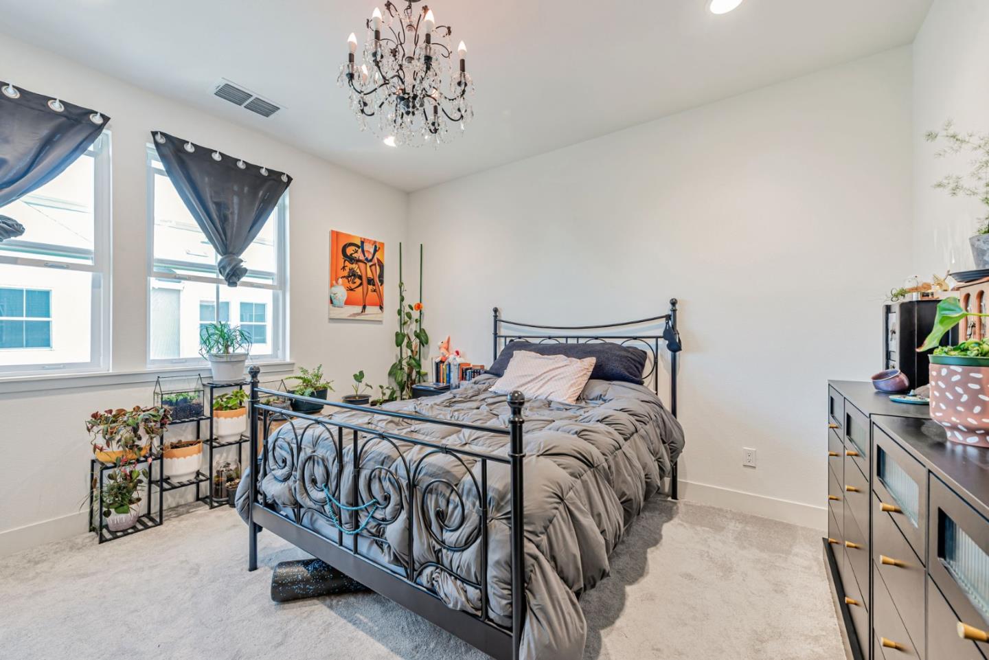 32 Seda Lane Morgan Hill, CA 95037 - Photo 9 of 37 a bedroom with a bed and a chandelier