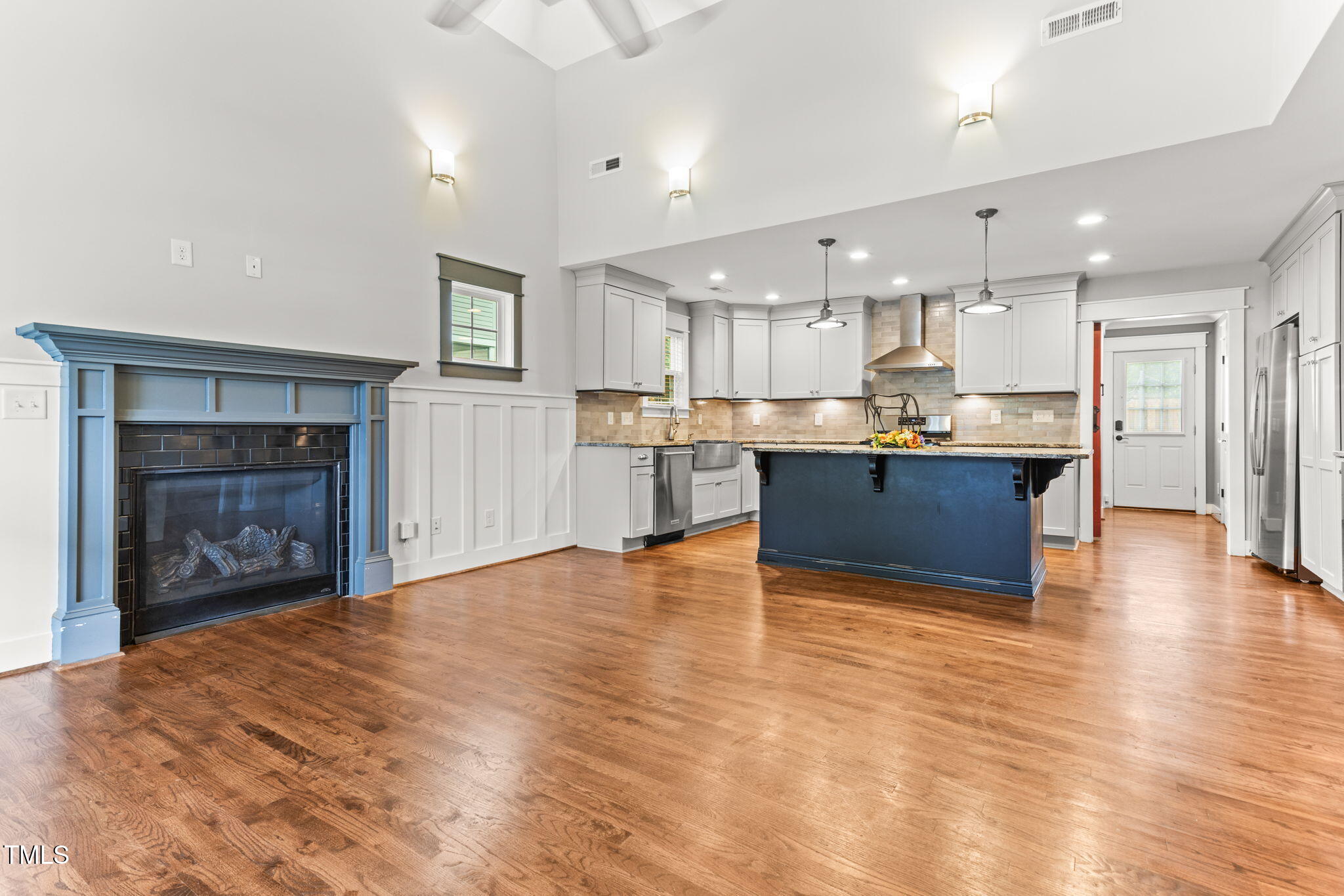 305 Georgetown Road Raleigh, NC 27608 - Photo 11 of 40 a view of a kitchen with a sink and a fireplace