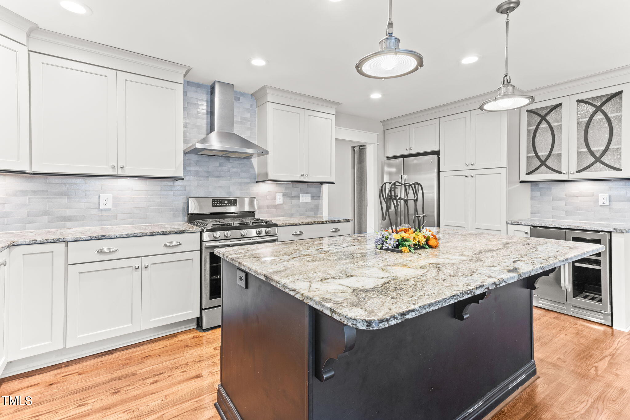 305 Georgetown Road Raleigh, NC 27608 - Photo 13 of 40 a kitchen with stainless steel appliances granite countertop a sink a stove and a refrigerator