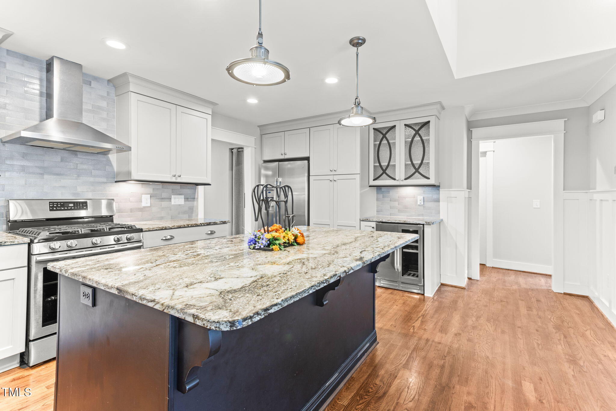 305 Georgetown Road Raleigh, NC 27608 - Photo 14 of 40 a kitchen with stainless steel appliances granite countertop a sink a stove and a wooden floors