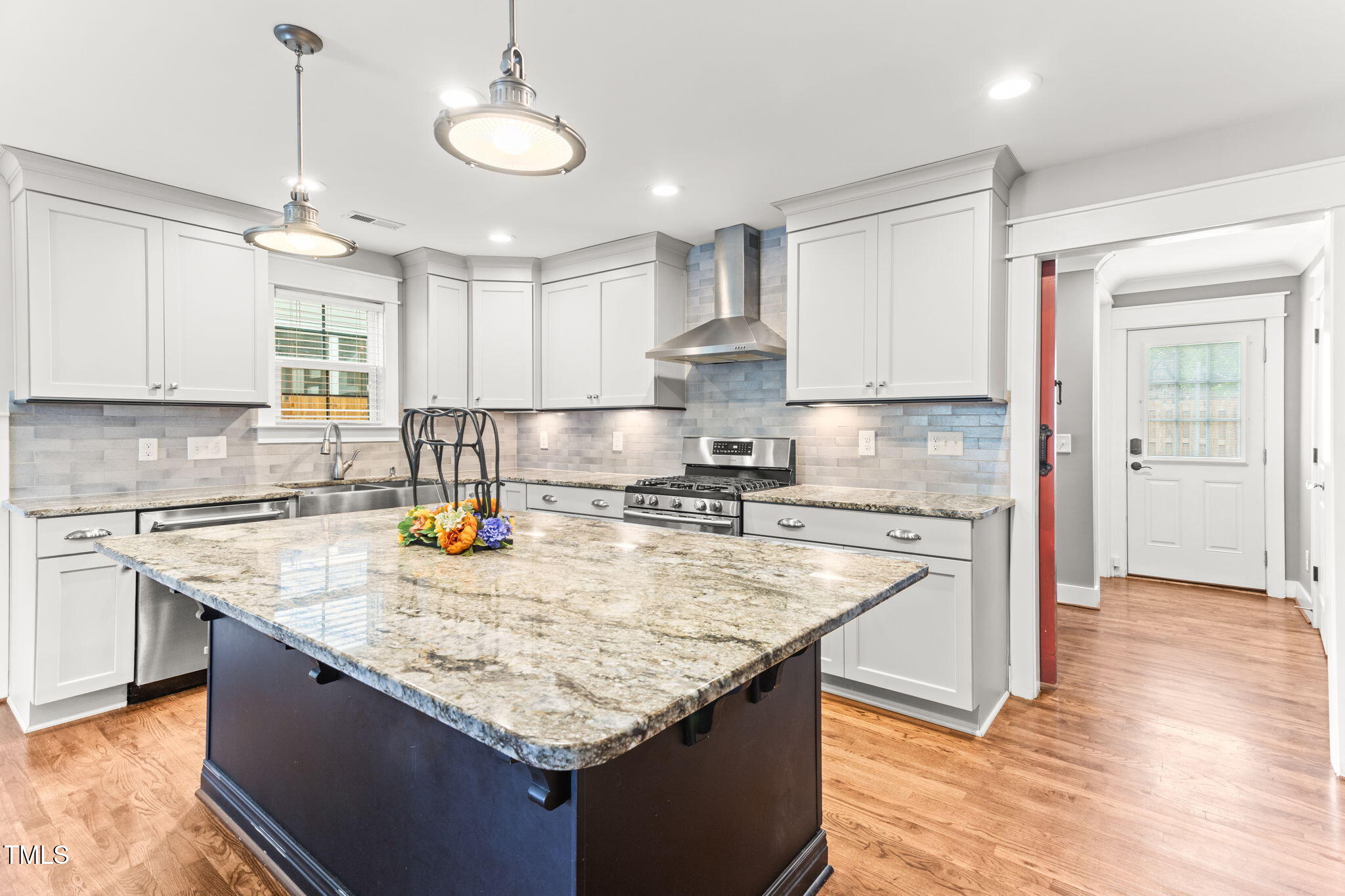 305 Georgetown Road Raleigh, NC 27608 - Photo 17 of 40 a kitchen with granite countertop a sink a counter top space appliances and cabinets