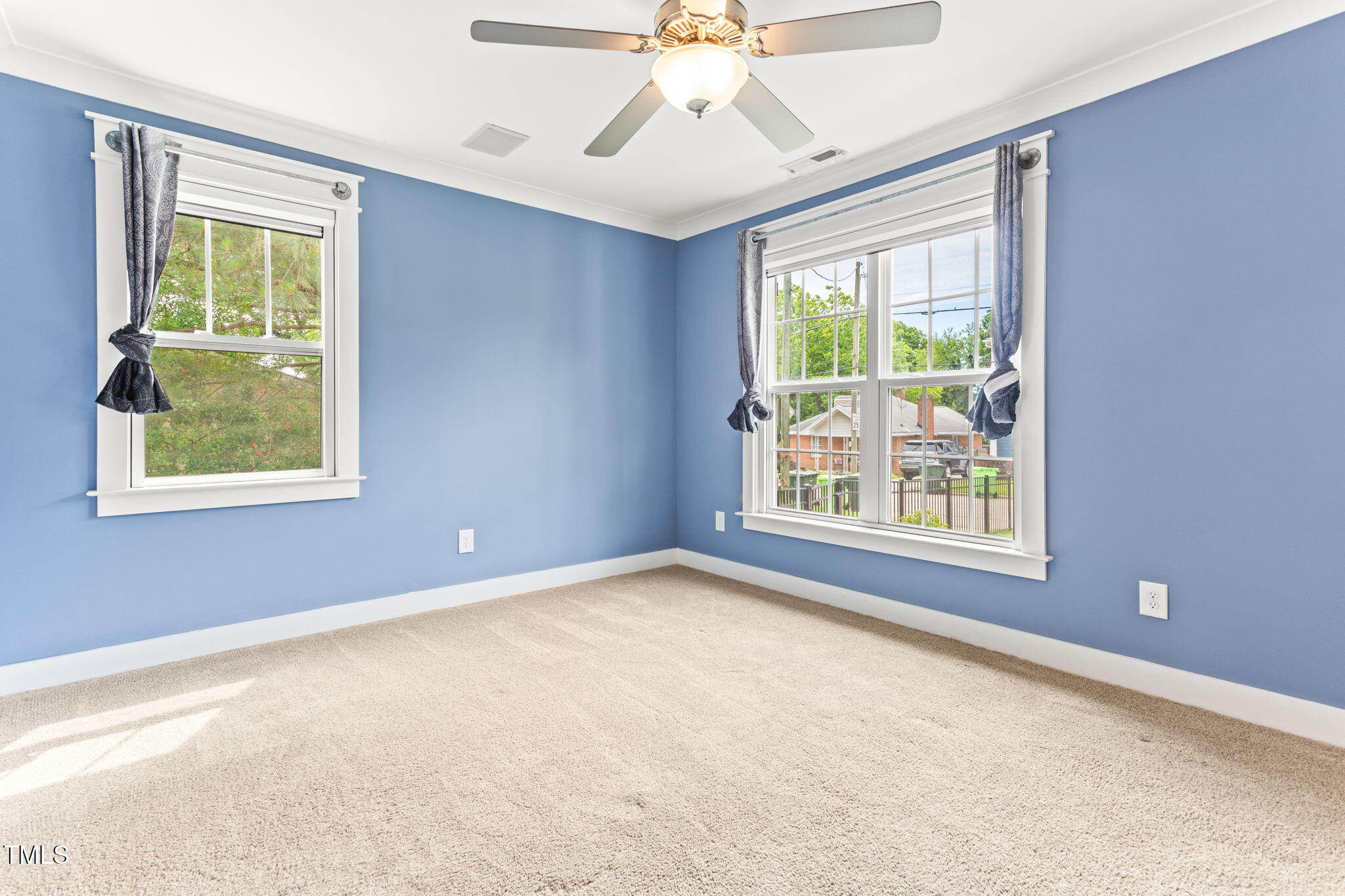 305 Georgetown Road Raleigh, NC 27608 - Photo 19 of 40 an empty room with windows and closet