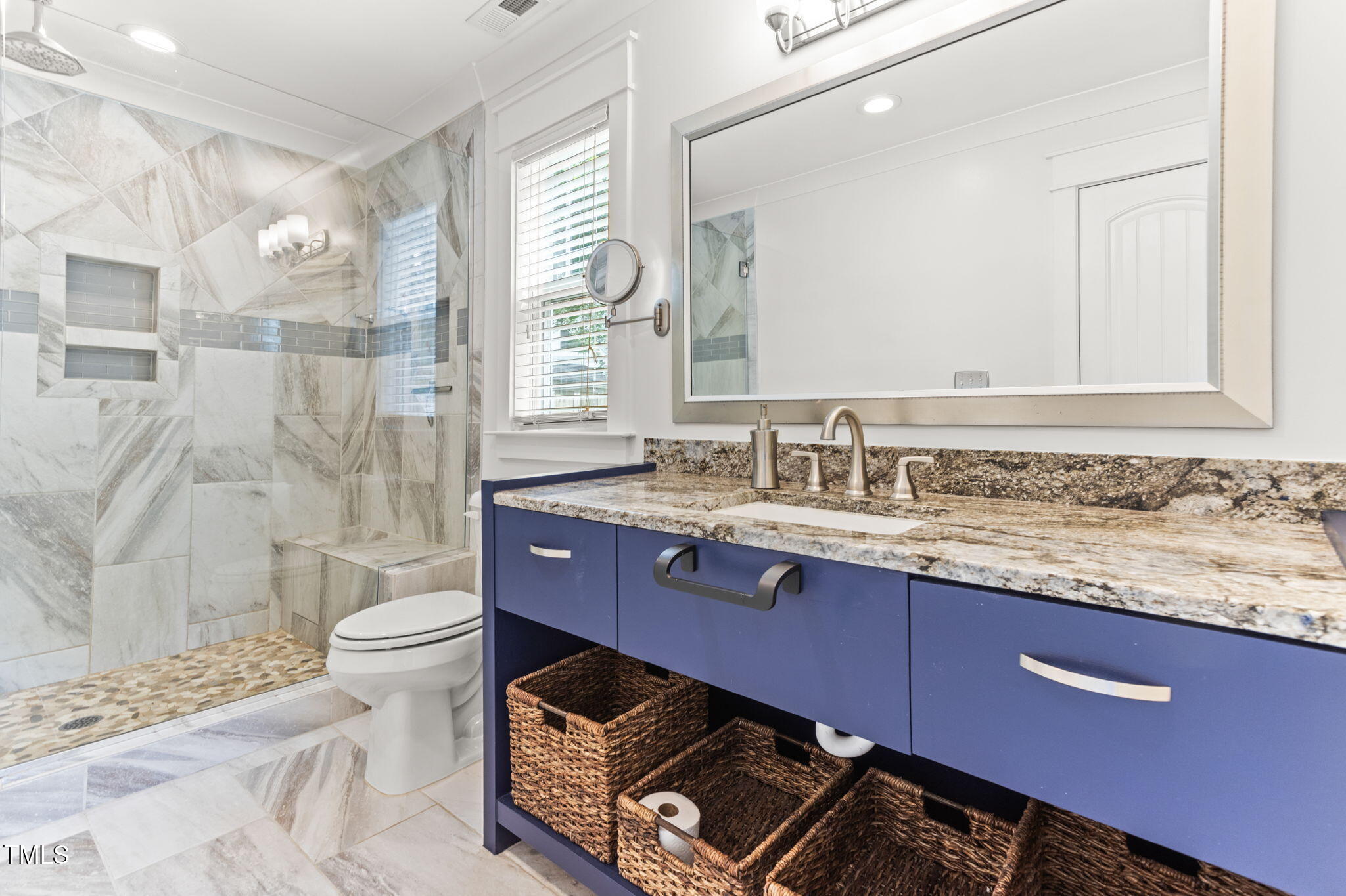 305 Georgetown Road Raleigh, NC 27608 - Photo 22 of 40 a bathroom with a granite countertop toilet sink and mirror