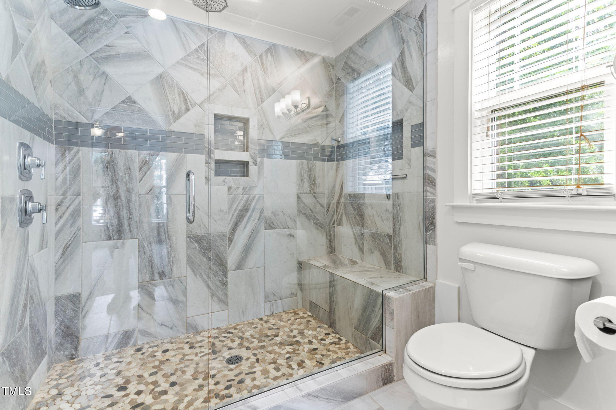 305 Georgetown Road Raleigh, NC 27608 - Photo 23 of 40 a white toilet sitting next to a shower curtain