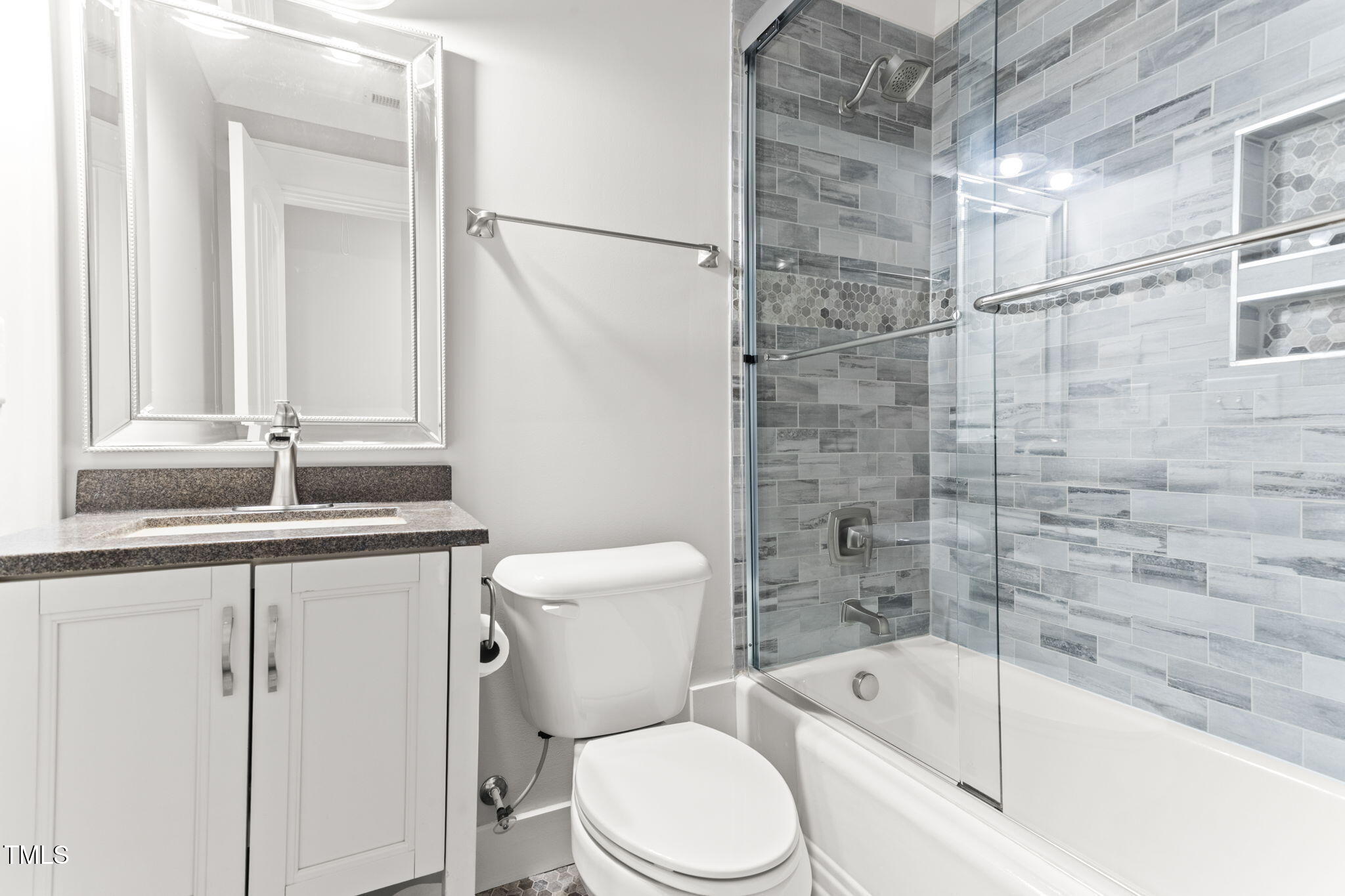 305 Georgetown Road Raleigh, NC 27608 - Photo 25 of 40 a bathroom with a sink a toilet and shower