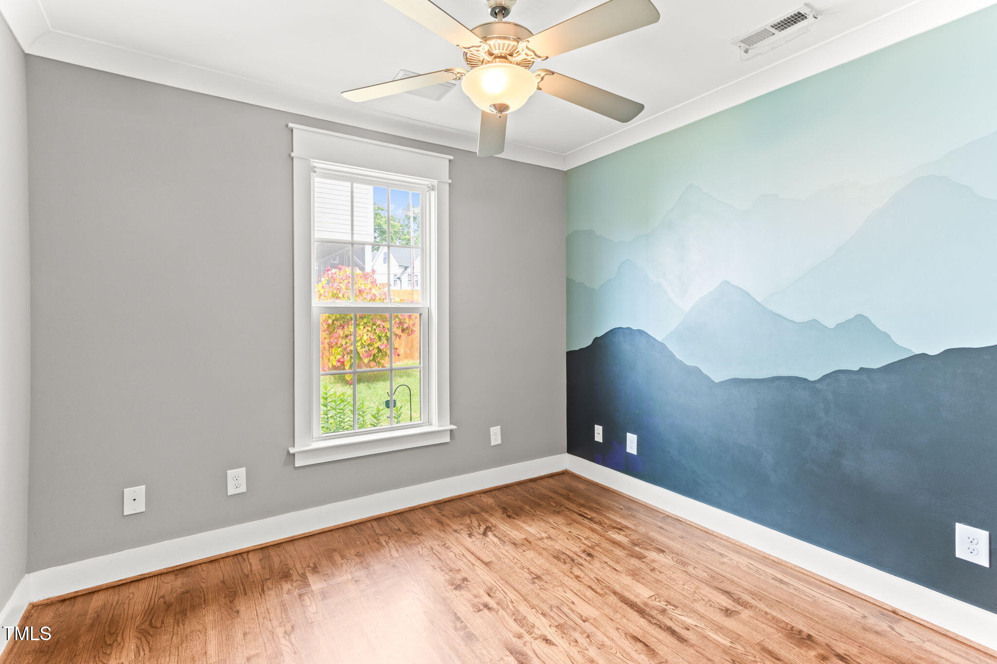 305 Georgetown Road Raleigh, NC 27608 - Photo 29 of 40 a view of an empty room with window and chandelier fan