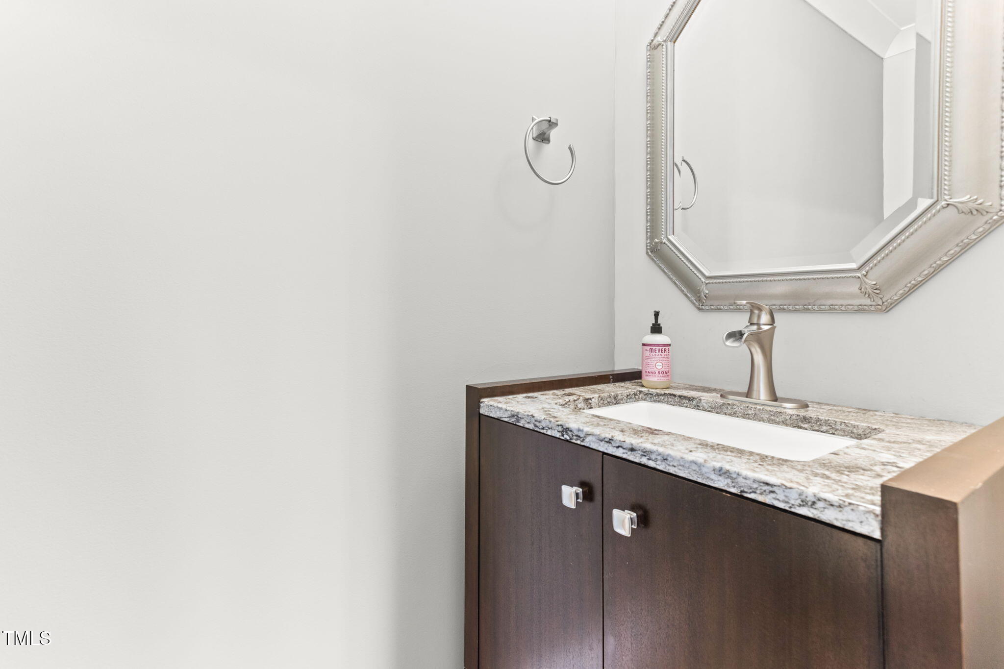 305 Georgetown Road Raleigh, NC 27608 - Photo 32 of 40 a bathroom with a granite countertop sink and a mirror