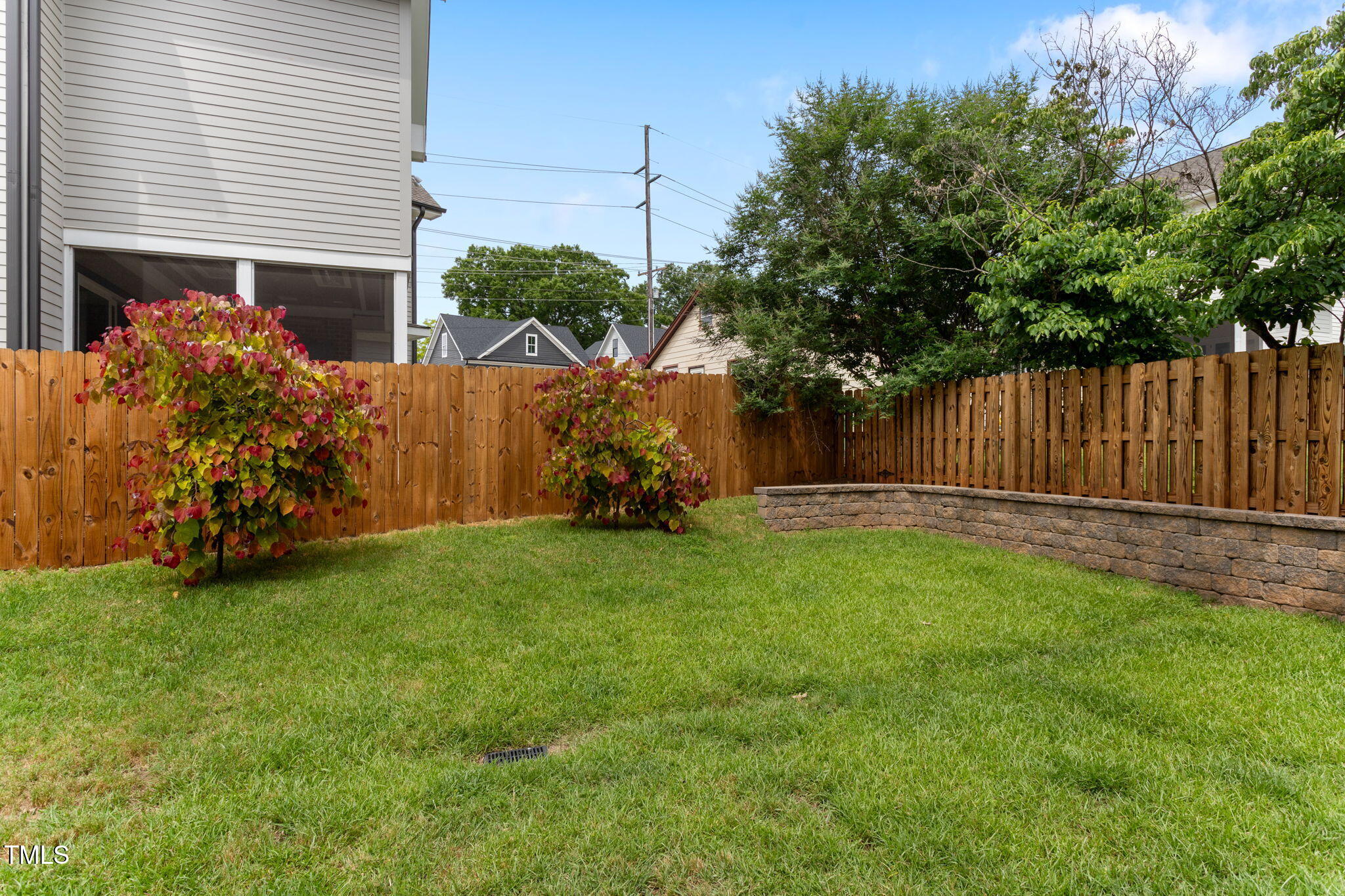 305 Georgetown Road Raleigh, NC 27608 - Photo 38 of 40 a view of backyard with potted plants and wooden fence