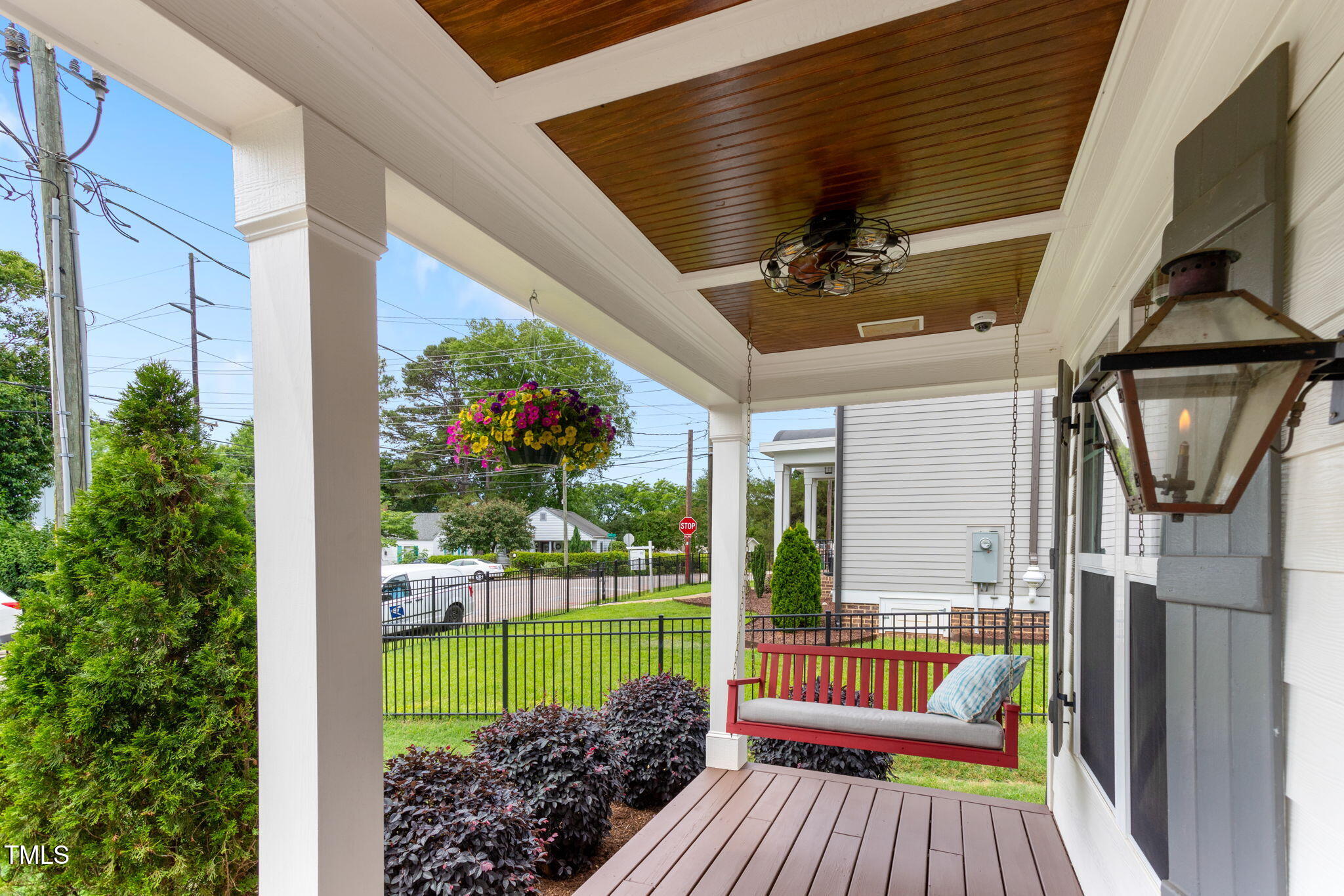 305 Georgetown Road Raleigh, NC 27608 - Photo 7 of 40 a view of a porch with furniture and a garden