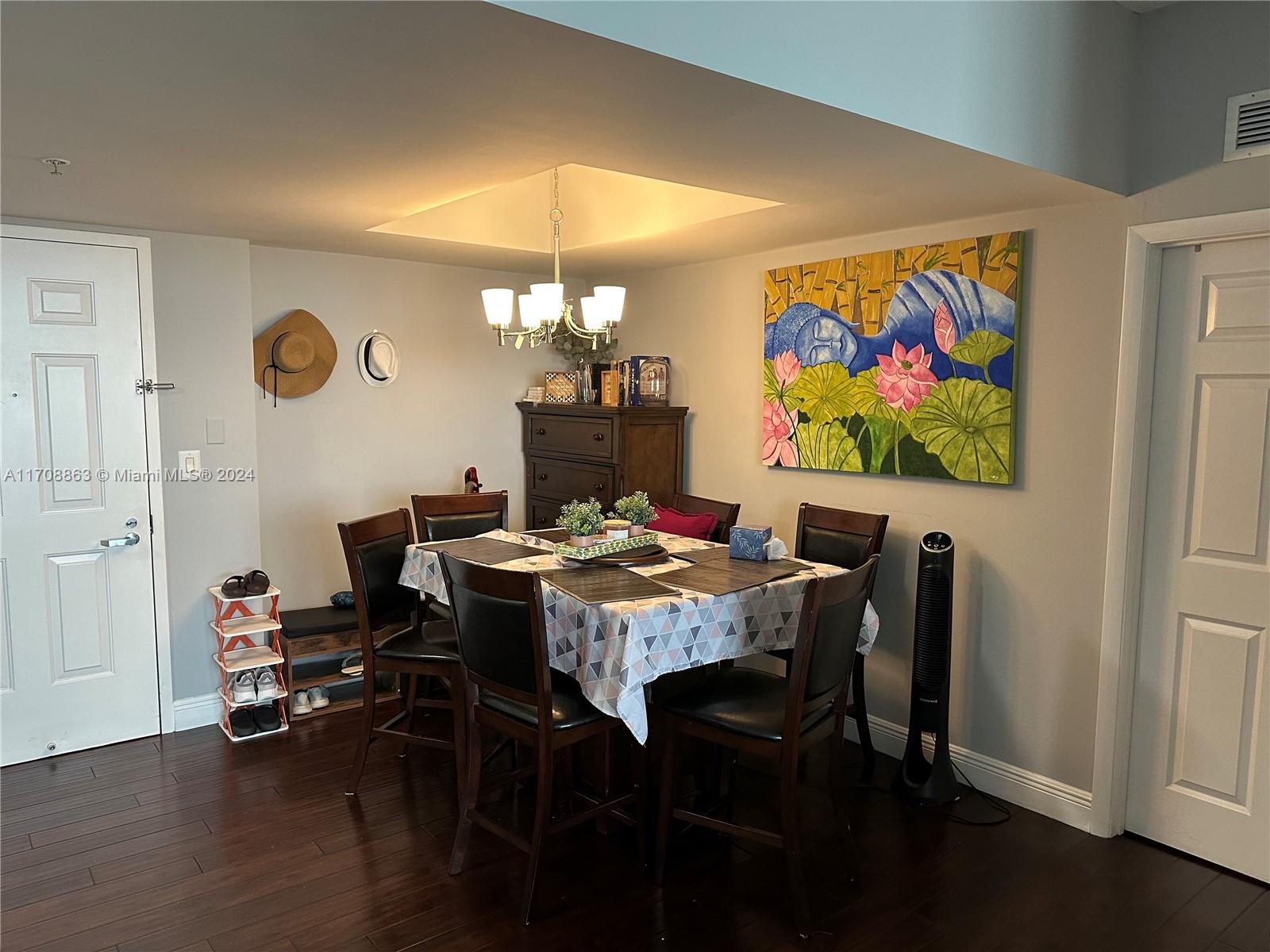 3232 Southwest 22nd Terrace, Unit 1903 Miami, FL 33145 - Photo 13 of 30 a view of a dining room with furniture and wooden floor