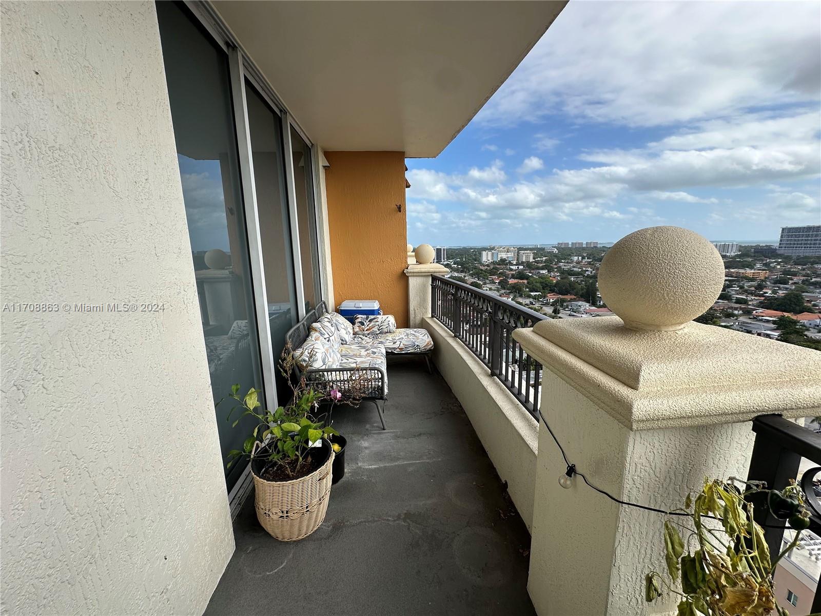 3232 Southwest 22nd Terrace, Unit 1903 Miami, FL 33145 - Photo 16 of 30 a view of a balcony with chairs