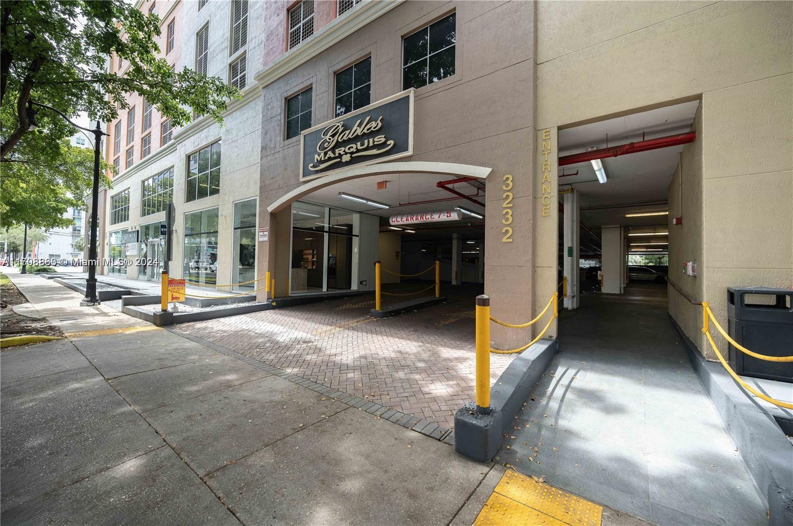 3232 Southwest 22nd Terrace, Unit 1903 Miami, FL 33145 - Photo 2 of 30 a view of a building with car parked